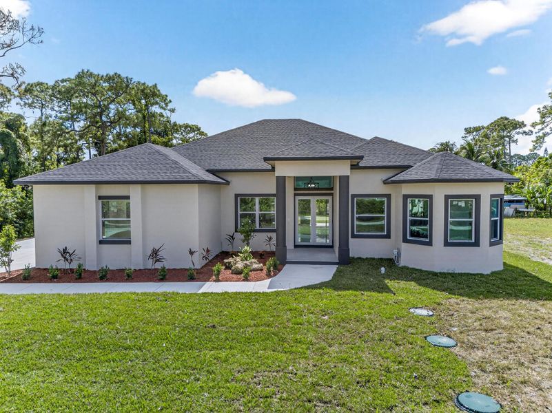 Exterior details and patio area of a home in , The Acreage (Image 28). Exterior details and patio area of a home in , The Acreage (Image 28).
