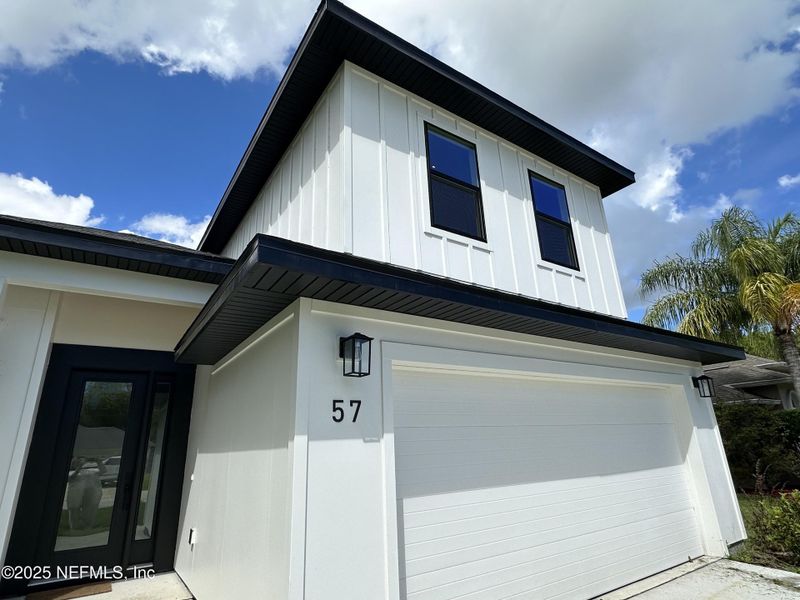 Front exterior of a new home in , Palm Coast, FL, highlighting curb appeal (Image 22).
