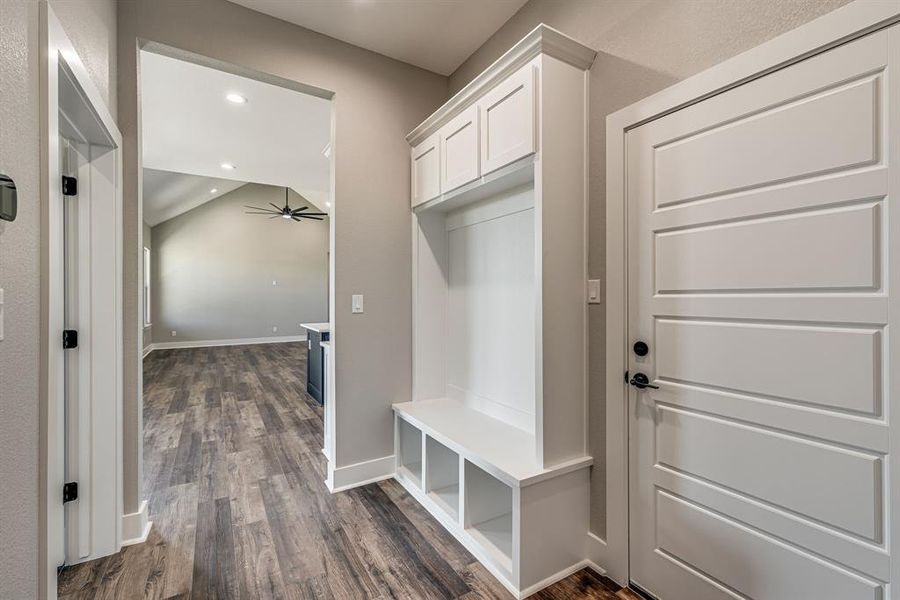 Mudroom with ceiling fan and dark hardwood / wood-style floors