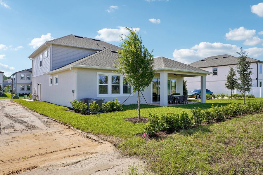 Exterior details and patio area of a home in Northlake at Ovation, Winter Garden (Image 24).