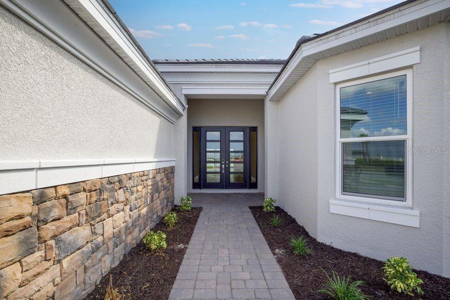 Exterior details and patio area of a home in Esplanade at Skye Ranch, Sarasota (Image 3).