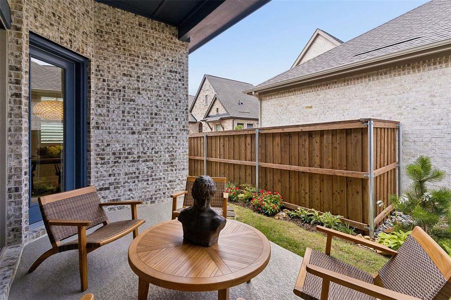 Exterior details and patio area of a home in Elements at Viridian - Garden Series, Arlington (Image 28).