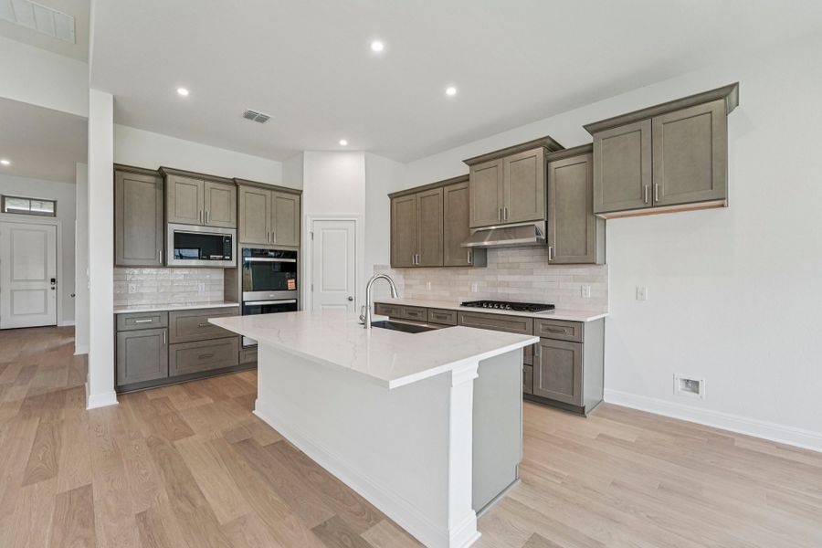 Furnished interior view inside a new home in Sage Hollow, Kyle (Image 5).