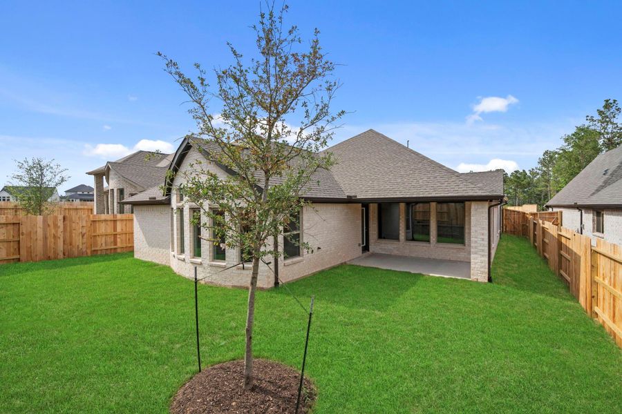 Exterior details and patio area of a home in Wildtree, Magnolia (Image 23).