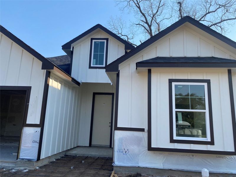 Front view of new construction home in process. Front view of new construction home in process.