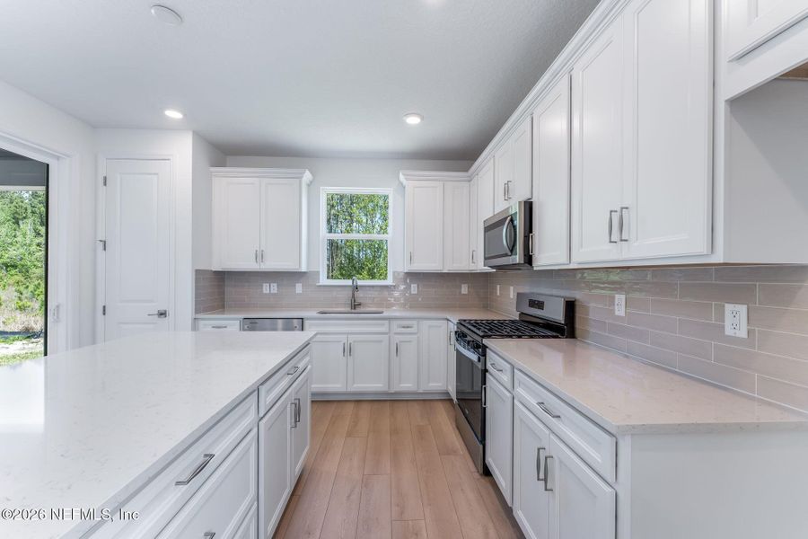 Furnished interior view inside a new home in Del Webb Wildlight, Yulee (Image 11).