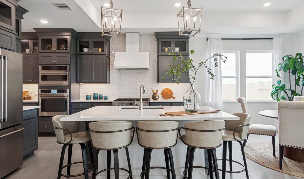 Kitchen with stacked glass-front upper cabinets Kitchen with stacked glass-front upper cabinets