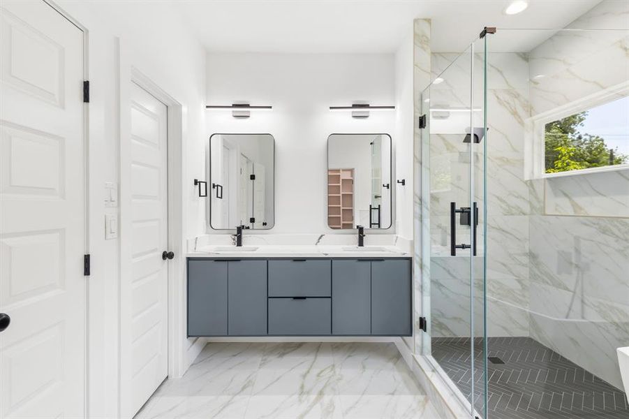 Double vanity with integrated sinks, quartz countertop, and matte black fixtures Double vanity with integrated sinks, quartz countertop, and matte black fixtures