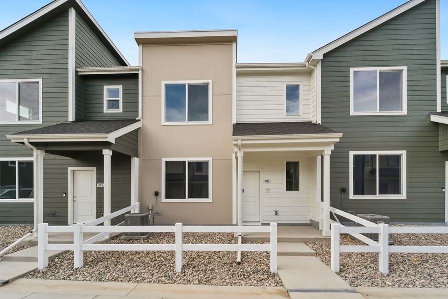 Front exterior of a new home in Liberty Draw, Evans, CO, highlighting curb appeal (Image 2).
