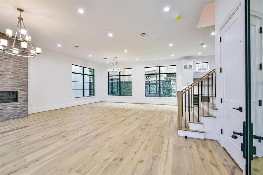 The Front Door opens into a welcoming Family Room, filled with abundant natural light.