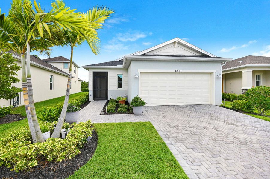 Front exterior of a new home in , Melbourne, FL, highlighting curb appeal (Image 22). Front exterior of a new home in , Melbourne, FL, highlighting curb appeal (Image 22).