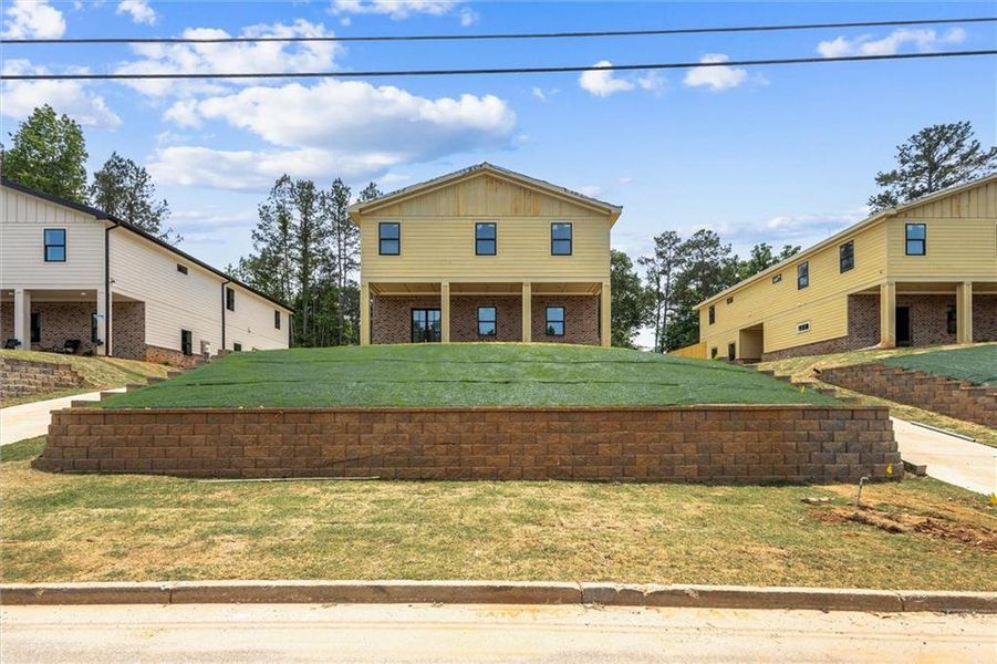 Front exterior of a new home in , Rex, GA, highlighting curb appeal (Image 1). Front exterior of a new home in , Rex, GA, highlighting curb appeal (Image 1).