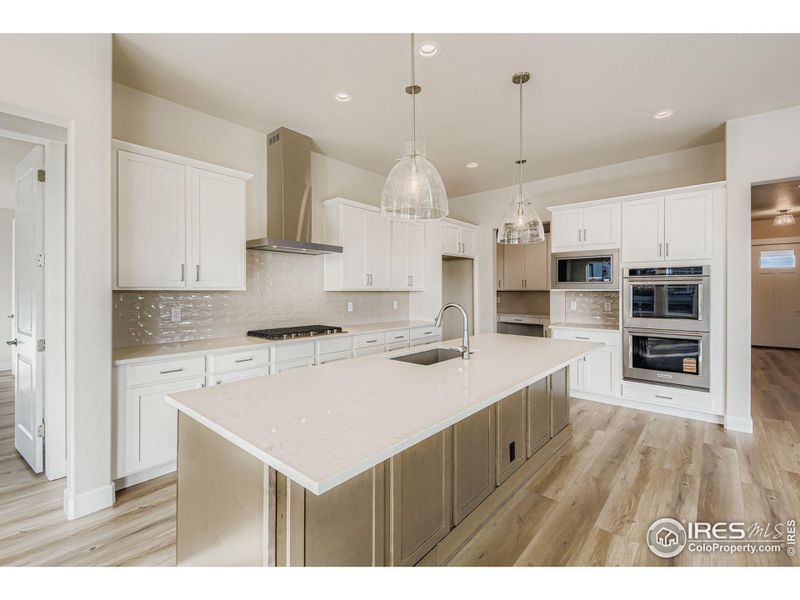 Furnished interior view inside a new home in RainDance National 60/70, Windsor (Image 6).