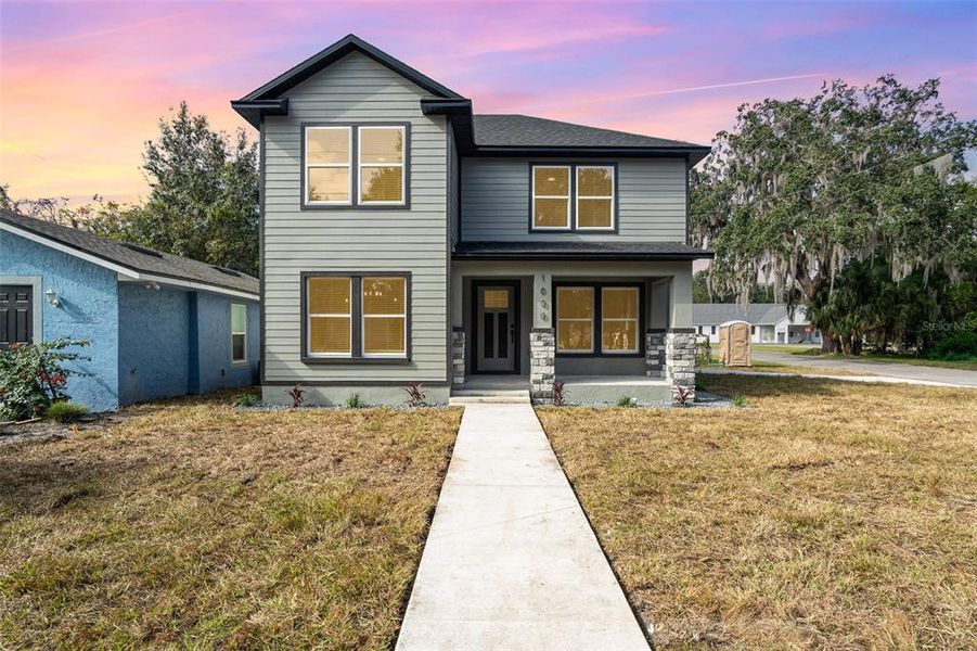Front exterior of a new home in , Sanford, FL, highlighting curb appeal (Image 2).