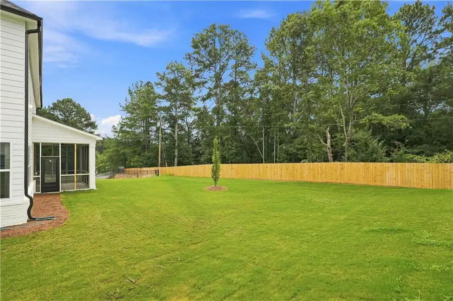 Exterior details and patio area of a home in The Stables at Ewing Chapel, Dacula (Image 4).