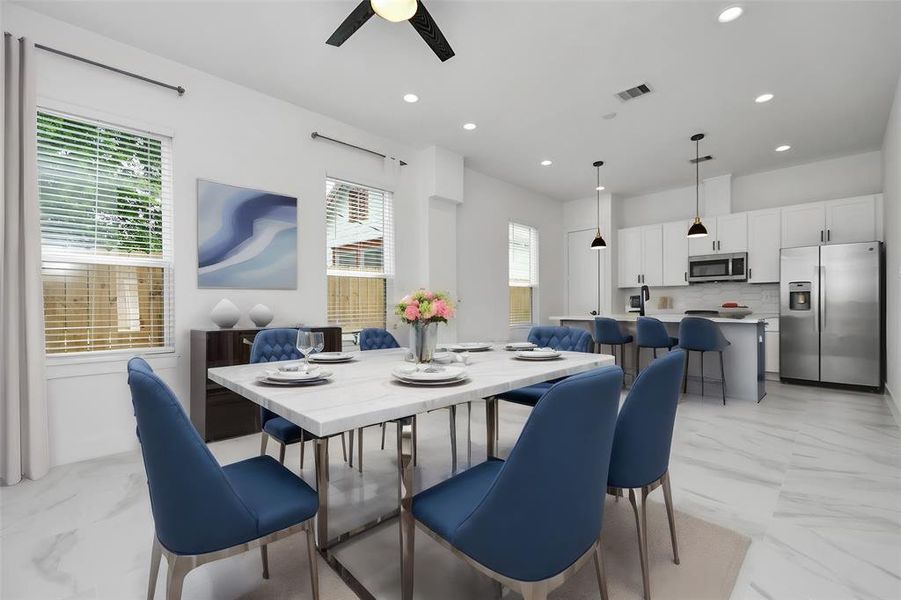 Experience effortless living with a design that seamlessly connects the living area, breakfast nook, and kitchen, amplifying space and comfort, with stainless steel appliances adding a touch of luxury. highlighted by a stunning kitchen with island and beautiful quartz countertops.