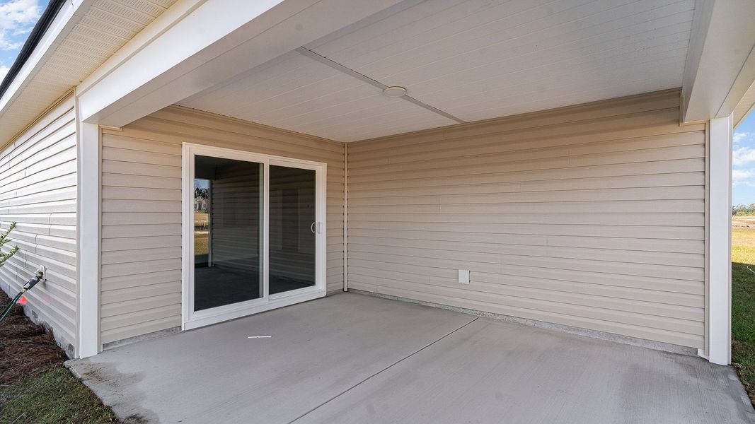 Exterior details and patio area of a home in Stanbury Creek, Supply (Image 2).