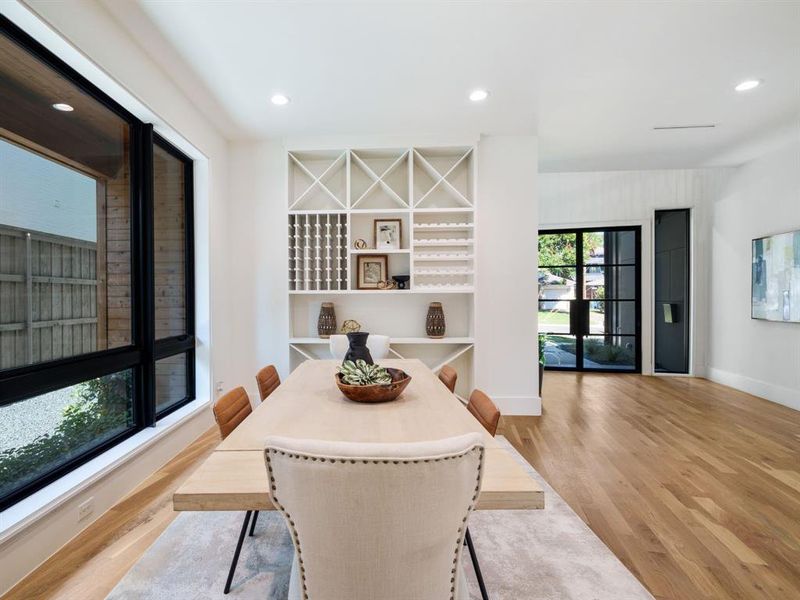 Dining area featuring recessed lighting and light wood-style flooring