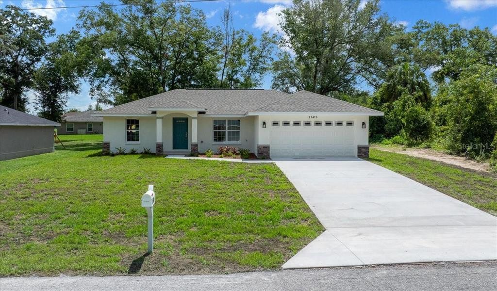 Front exterior of a new home in , Belleview, FL, highlighting curb appeal (Image 21).