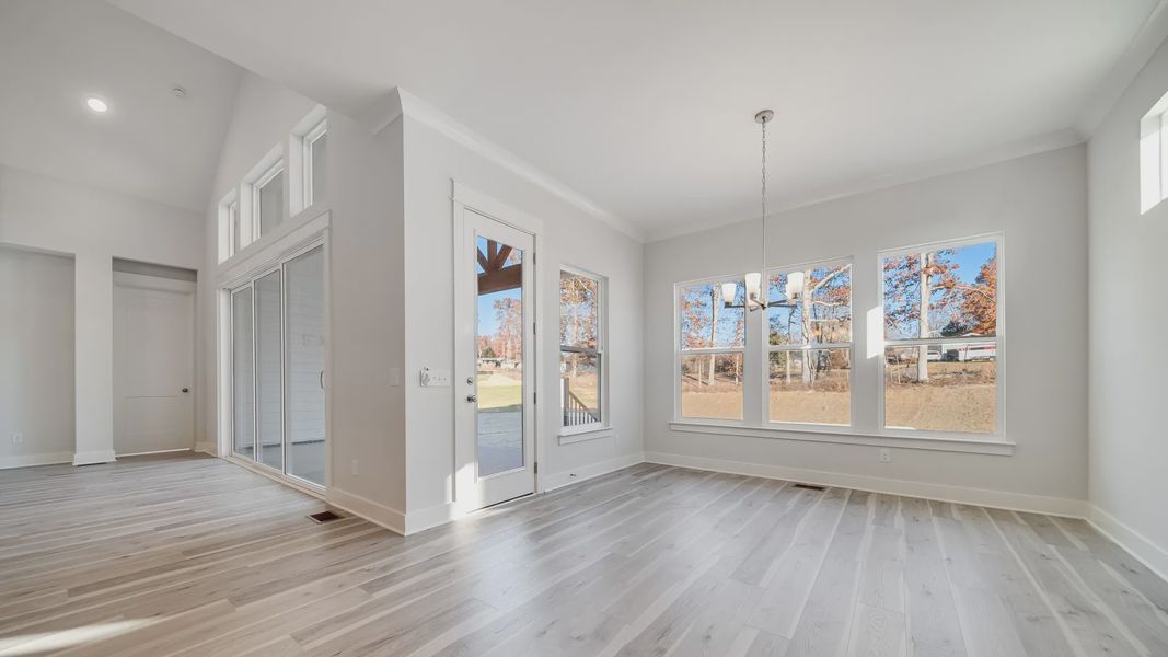 Open Dining area with large amount of natural light near the kitchen