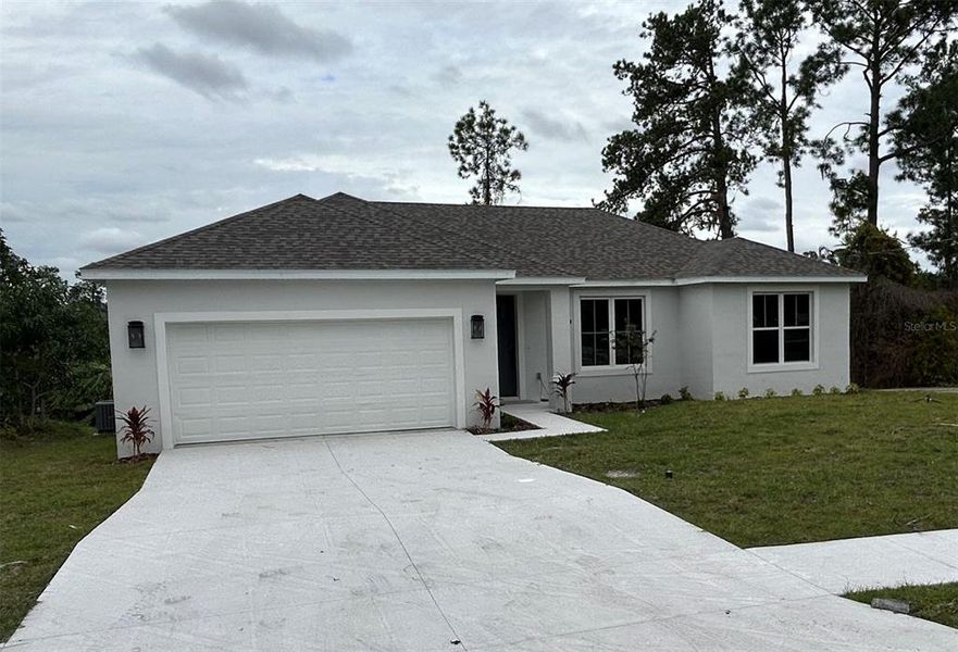 Front exterior of a new home in , Deltona, FL, highlighting curb appeal (Image 1).