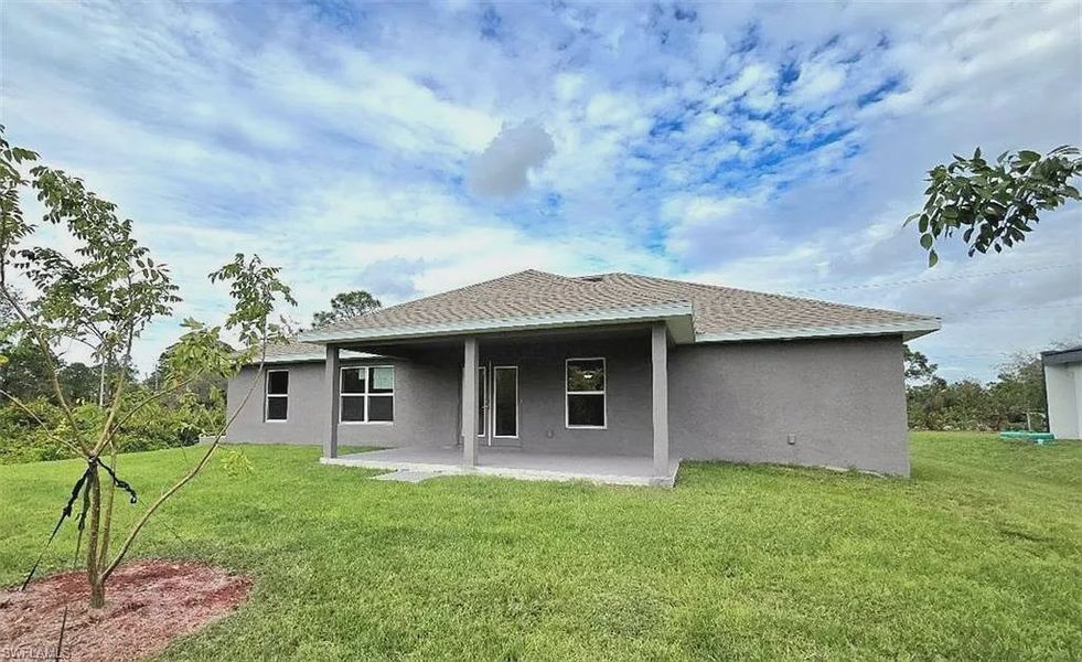 Front exterior of a new home in Lehigh Acres, Lehigh Acres, FL, highlighting curb appeal (Image 12).
