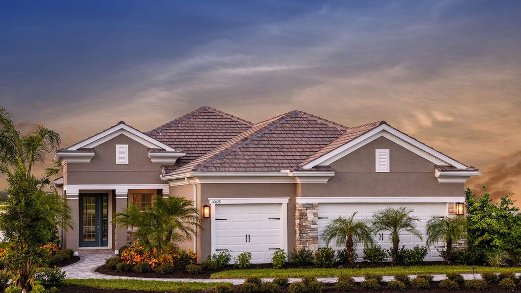 Front exterior of a new home in Grand Park Real Estate and Homes for Sale in Sarasota, FL - Neal Communities, Sarasota, FL, highlighting curb appeal (Image 23). Front exterior of a new home in Grand Park Real Estate and Homes for Sale in Sarasota, FL - Neal Communities, Sarasota, FL, highlighting curb appeal (Image 23).