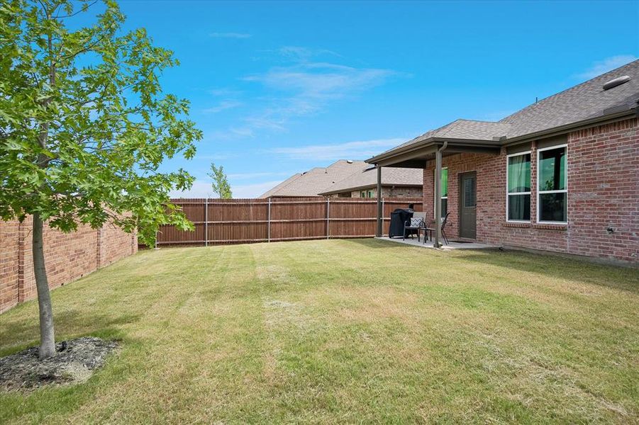 Exterior details and patio area of a home in Whitewing Trails, Princeton (Image 4).