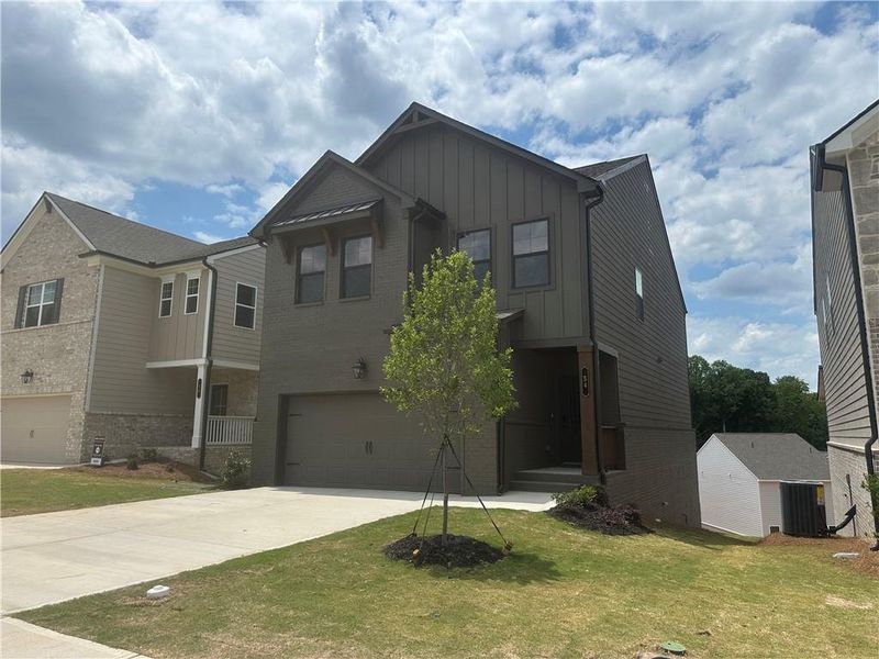Front exterior of a new home in Kentmere, Auburn, GA, highlighting curb appeal (Image 19).