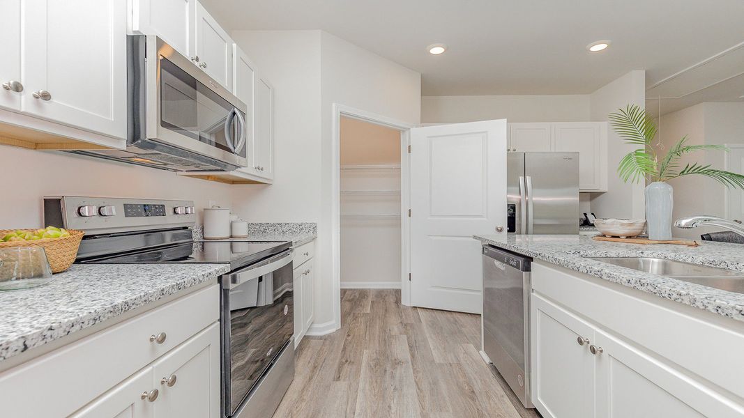 Furnished interior view inside a new home in Brunswick Plantation, Ash (Image 6).