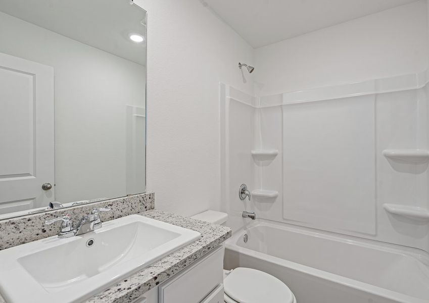 Secondary bathroom ith a shower/tub combination