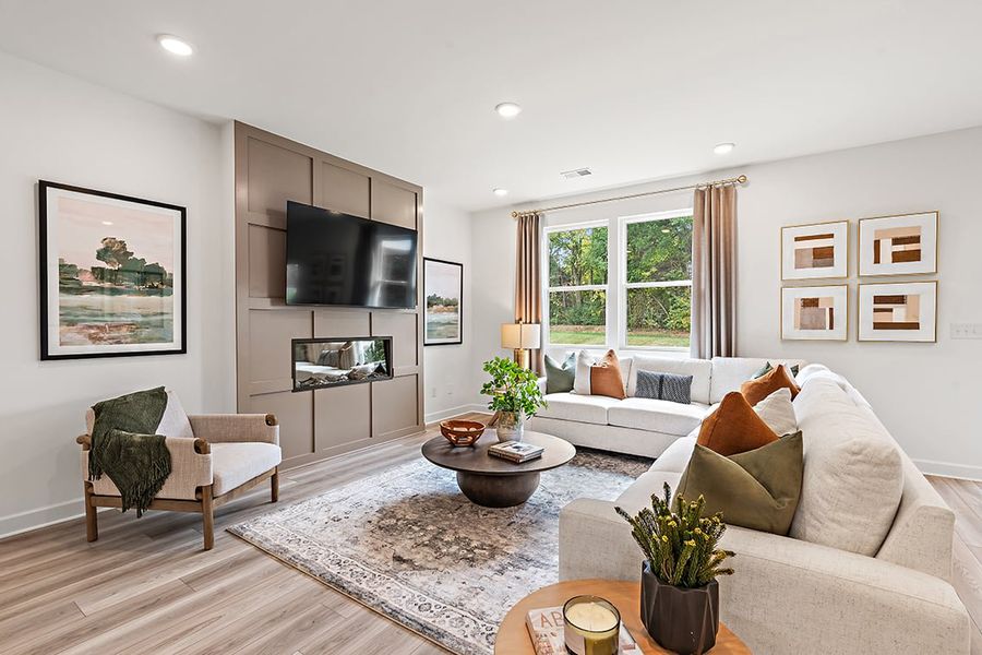 A living room with a tv and couches.