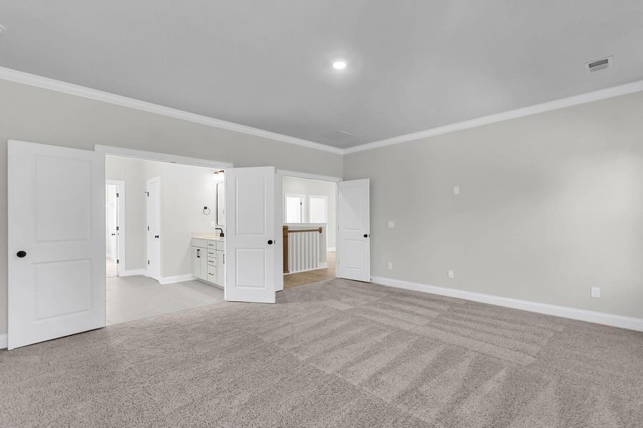 Spacious, unfurnished interior of a new home in Tidewater at Lakes of Cane Bay, Summerville (Image 24).