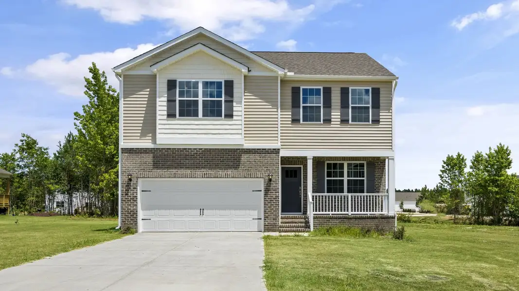 Front exterior of a new home in Baker Farm, Youngsville, NC, highlighting curb appeal (Image 1). Front exterior of a new home in Baker Farm, Youngsville, NC, highlighting curb appeal (Image 1).