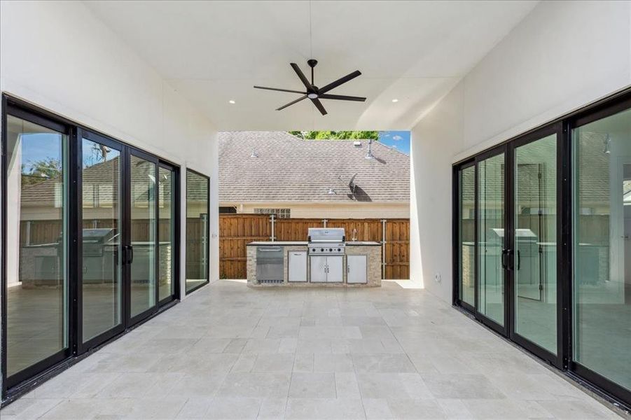 View of terrace with ceiling fan and grilling area