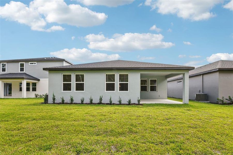 Exterior details and patio area of a home in , Ormond Beach (Image 25).