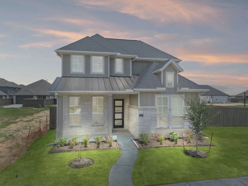 Representative exterior photo of a completed home built from the St Andrews by Chesmar Homes in Riceland Alley Loads, Mont Belvieu, TX (Image 28).