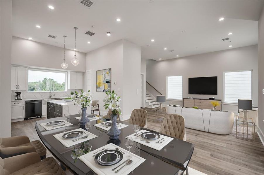 There is a great flow from the kitchen into the dining and living area, perfect for entertaining or spending a cozy evening at home. (Virtually staged)