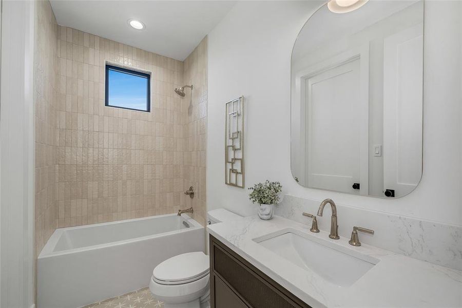 Contemporary bathroom featuring a rectangular soaking tub, vertical subway tile shower surround, and a vanity with a white countertop and undermount sink