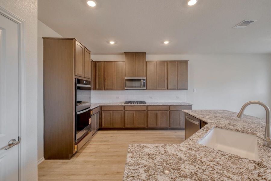 Furnished interior view inside a new home in River Bluff, Leander (Image 5).
