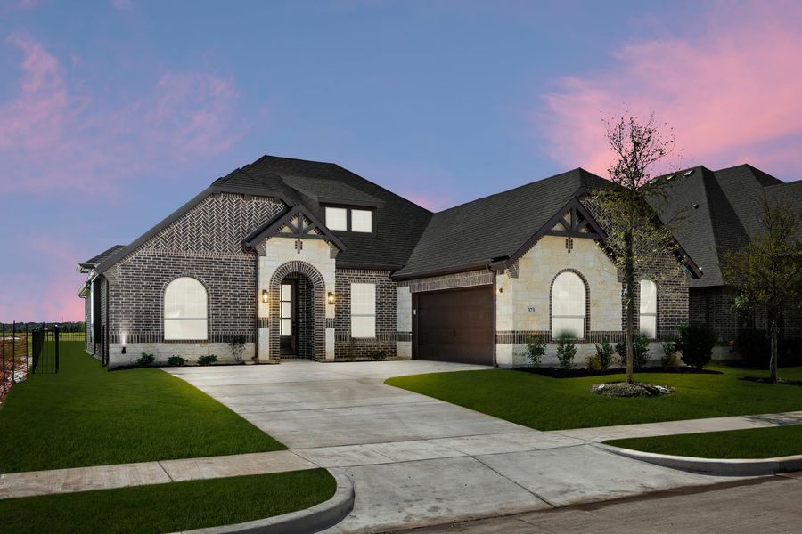 Front exterior of a new home in Abe’s Landing, Granbury, TX, highlighting curb appeal (Image 2). Front exterior of a new home in Abe’s Landing, Granbury, TX, highlighting curb appeal (Image 2).
