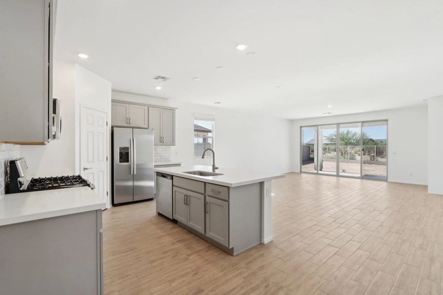 Kitchen and great room. Not actual home, finishes may vary. Kitchen and great room. Not actual home, finishes may vary.
