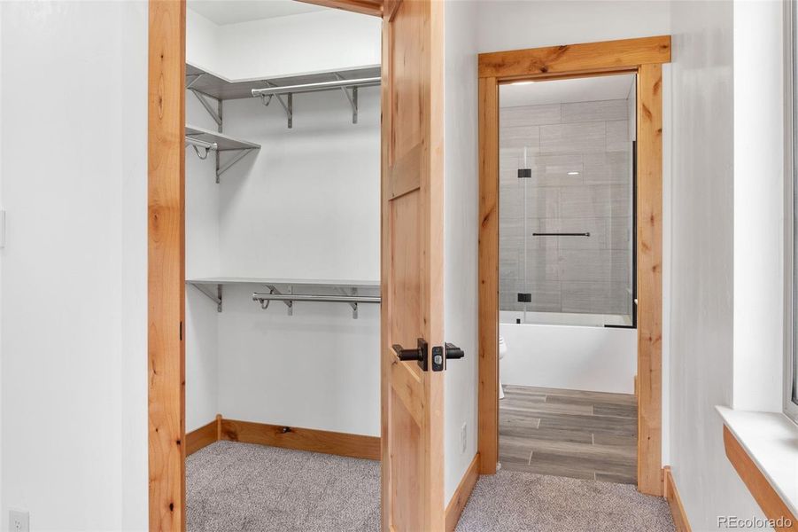 Primary bedroom walk-in closet and private full bath