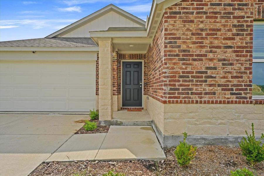 Entrance to property with a garage