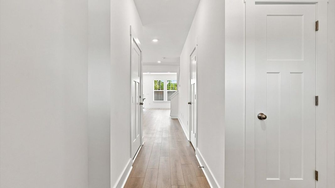Stylish foyer with hardwood flooring and tasteful architectural detail in a superior layout by DRB Homes Stylish foyer with hardwood flooring and tasteful architectural detail in a superior layout by DRB Homes