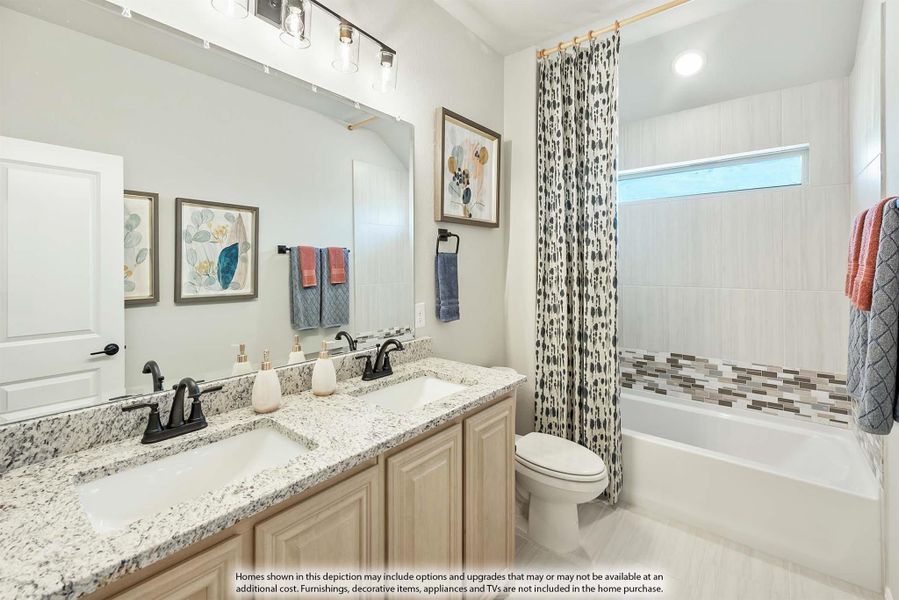 Bathroom with double granite vanity, tub-shower combo with tile surround, and large mirror Bathroom with double granite vanity, tub-shower combo with tile surround, and large mirror