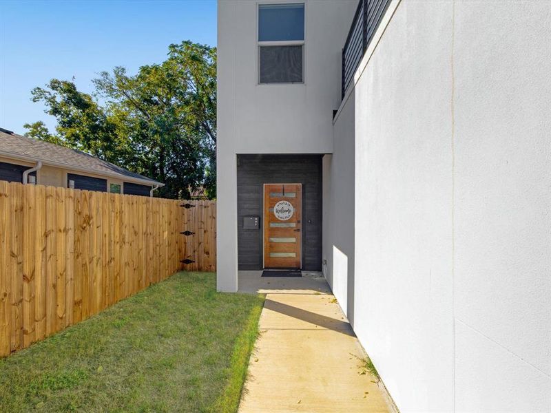 Property entrance featuring a lawn