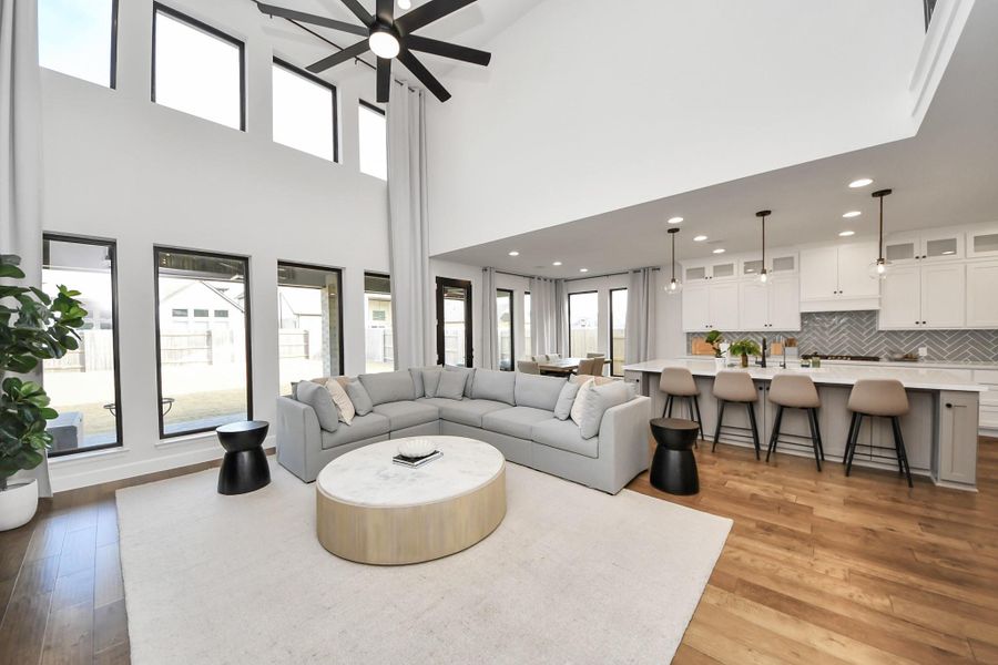 Spacious gathering area open to kitchen and dining spaces.