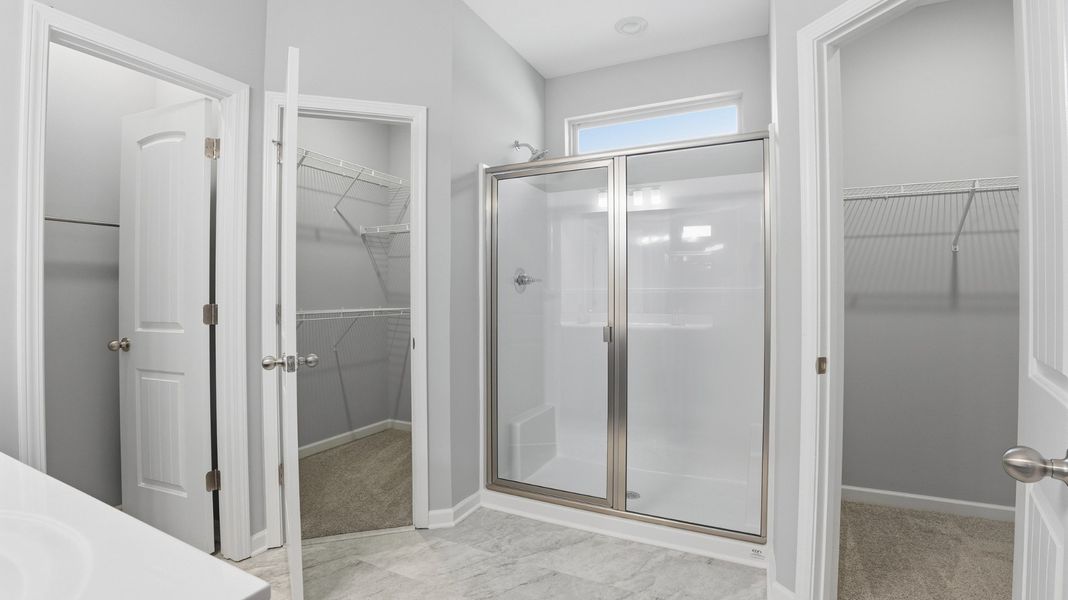 primary bathroom with, double sinks, 5' shower, 2 primary closets, linen closet, water closet