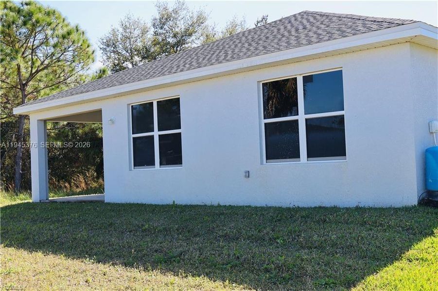 Exterior details and patio area of a home in , Lehigh Acres (Image 13). Exterior details and patio area of a home in , Lehigh Acres (Image 13).